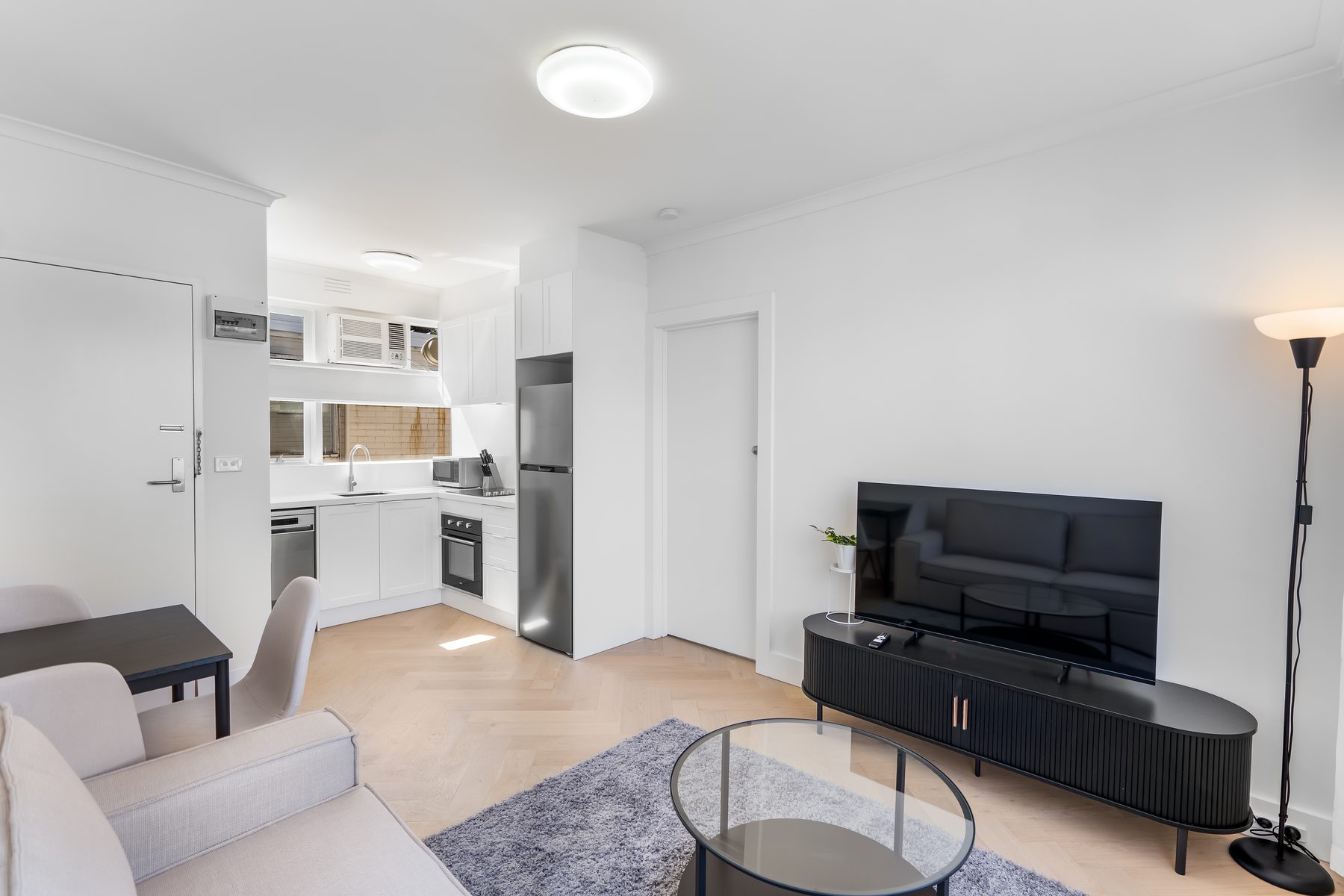 Open-plan kitchen and living area in a Melbourne apartment